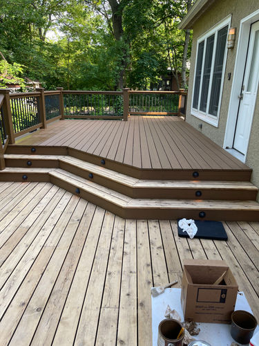 Porch with old paint removed and natural wood sanded and exposed