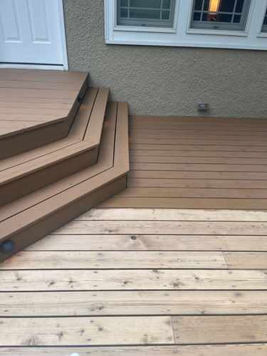 Porch with fresh stain and new finish being applied